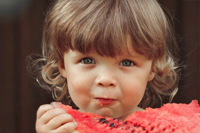 Child eating watermelon 